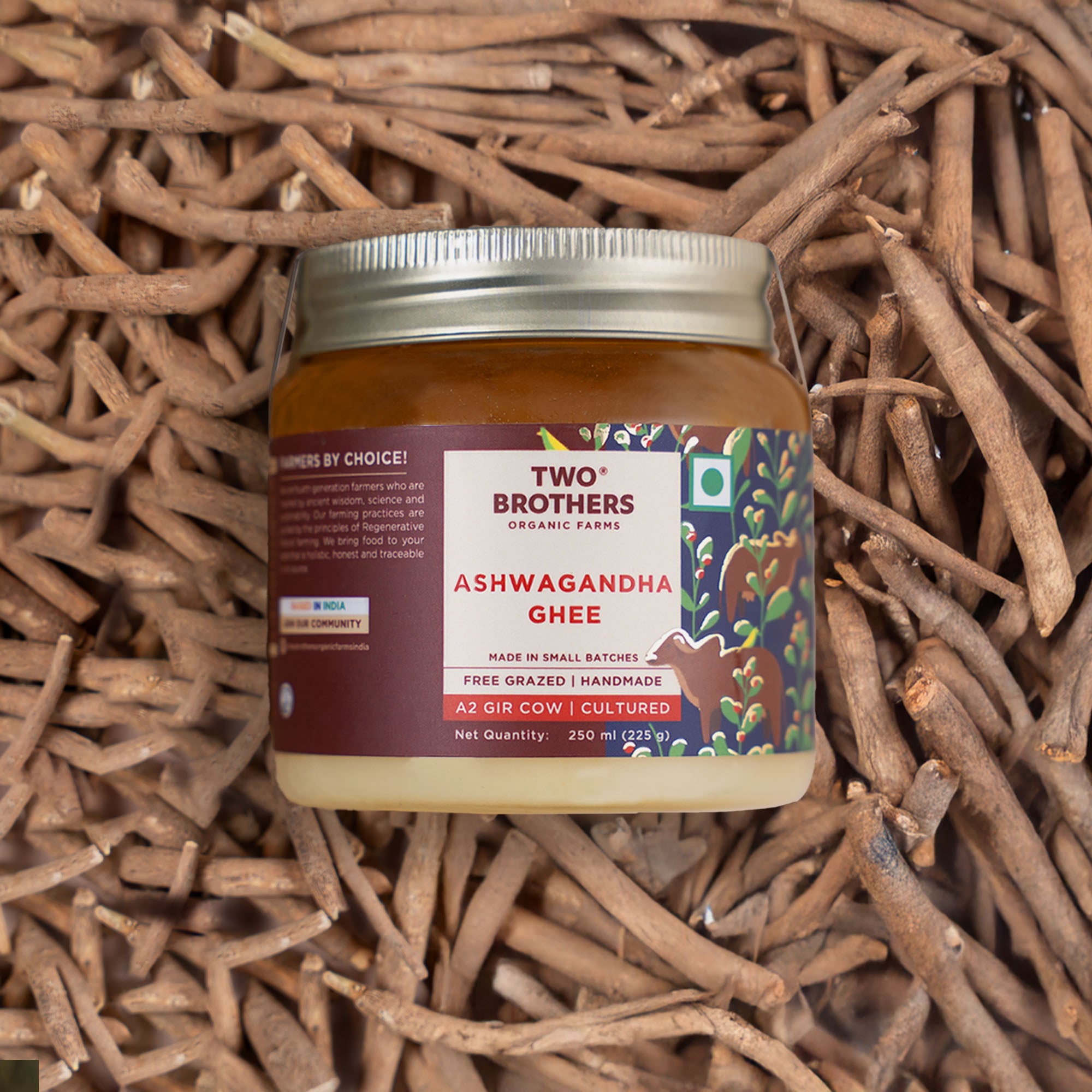 Two Brothers Organic Farms Ashwagandha Ghee jar on ashwagandha roots background