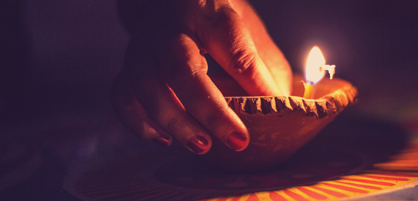 Lighting Diya in Diwali 