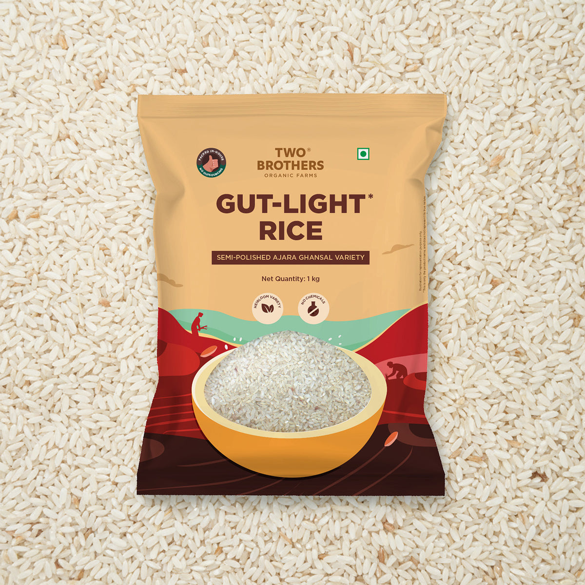 Two Brothers Organic Farms Gut-Light Rice 1kg packet of semi-polished Ajara Ghansal variety, displayed on a background of raw rice grains.