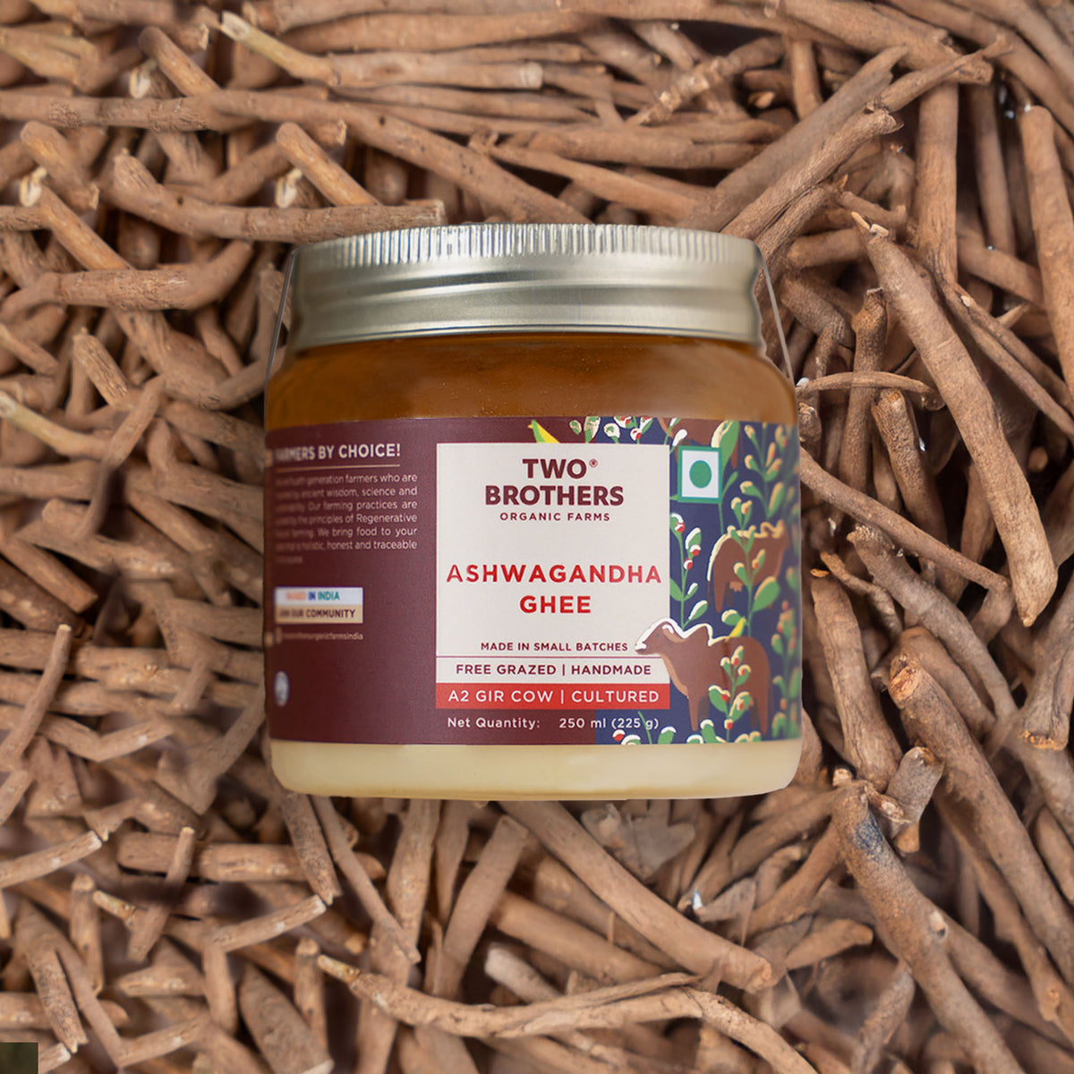 Two Brothers Organic Farms Ashwagandha Ghee jar on ashwagandha roots background