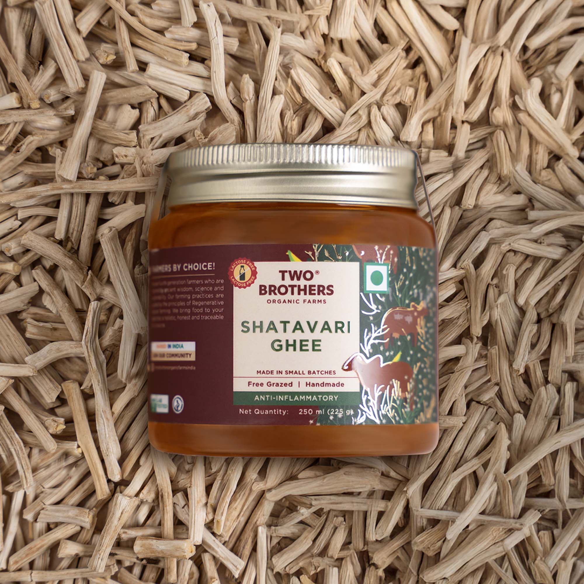 Two Brothers Organic Farms Shatavari Ghee jar on shatavari roots background